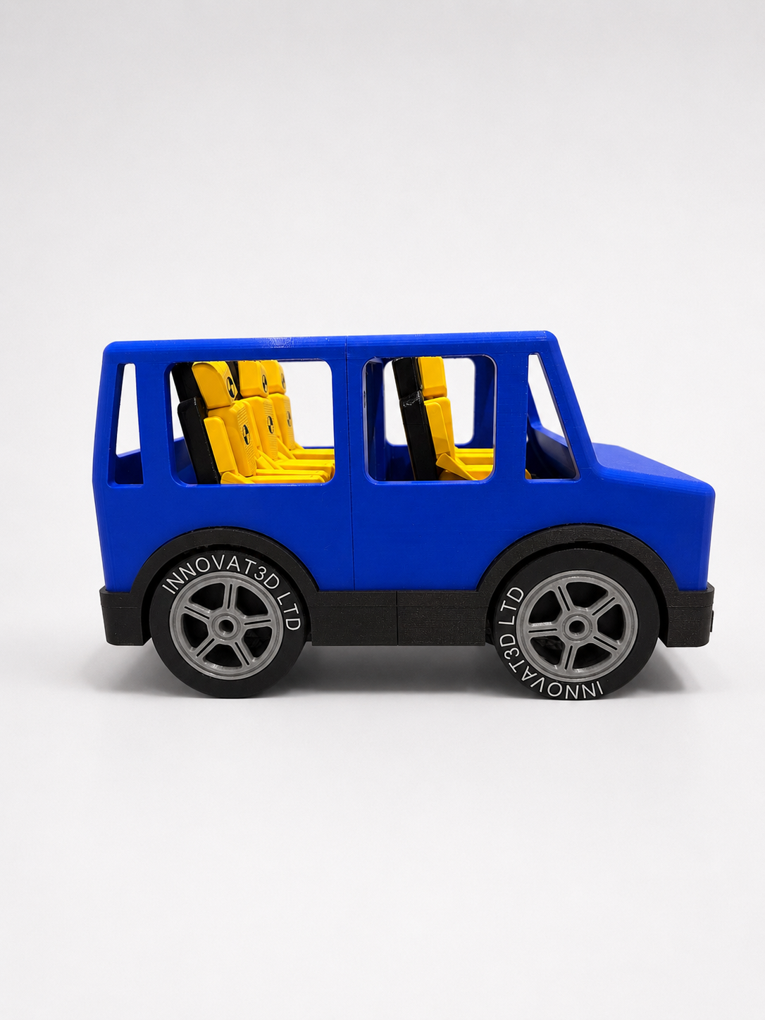 Side profile of the seatbelt demonstration car showing seating and branded wheels
